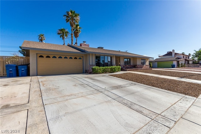 ranch-style house featuring a garage