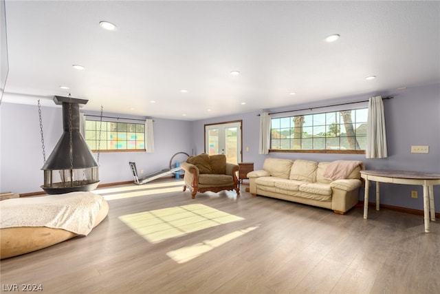 living room with hardwood / wood-style floors and french doors