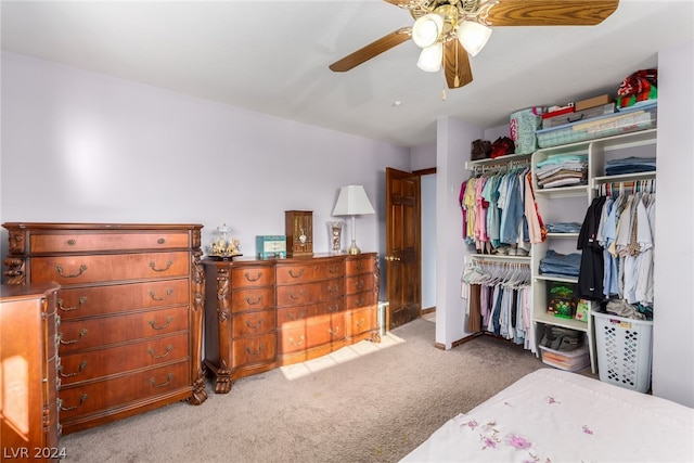 bedroom with a closet, carpet floors, and ceiling fan