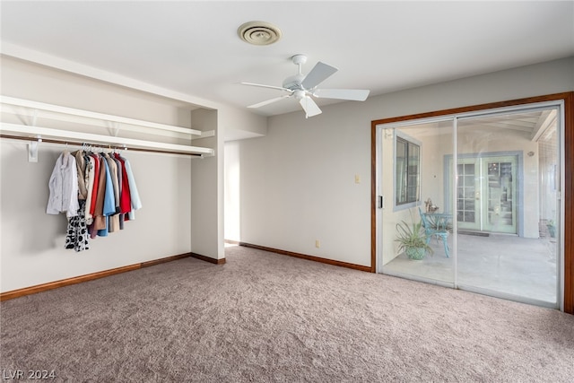 unfurnished bedroom featuring a closet, carpet floors, and ceiling fan