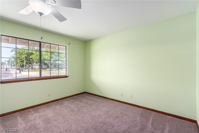 unfurnished room featuring carpet and ceiling fan