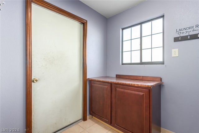 bathroom featuring tile floors