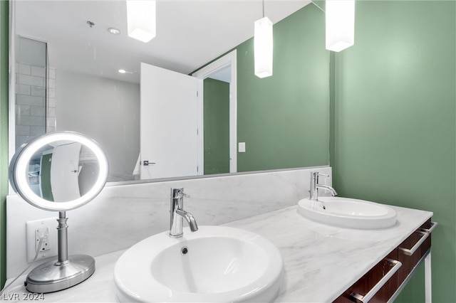 bathroom with oversized vanity and dual sinks