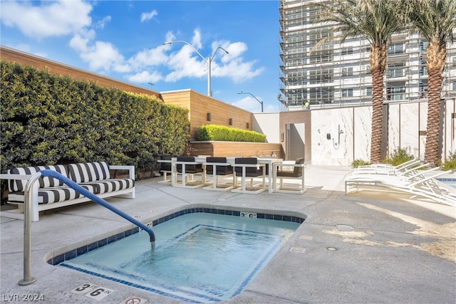 view of pool featuring outdoor lounge area and a patio area