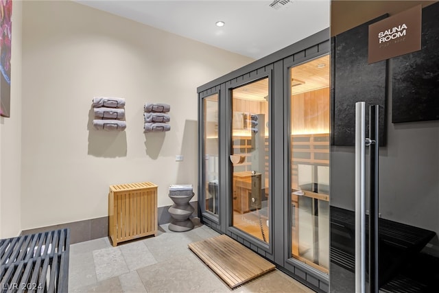 interior space with french doors and radiator