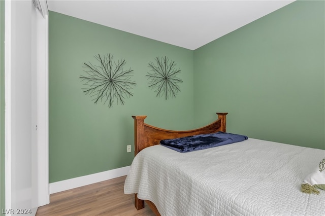 bedroom featuring hardwood / wood-style flooring