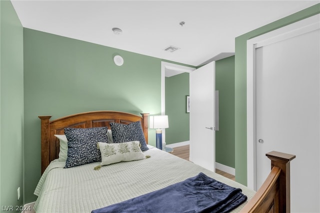 bedroom with wood-type flooring