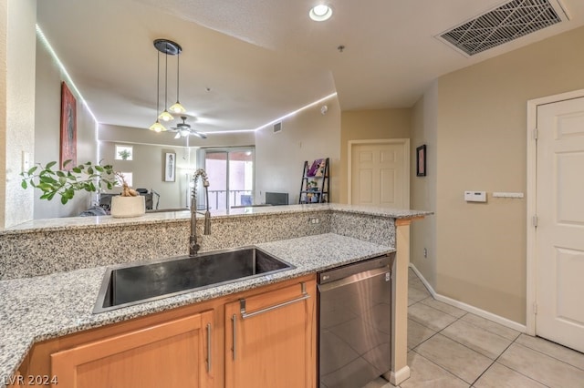 kitchen featuring ceiling fan, stainless steel dishwasher, decorative light fixtures, light tile floors, and sink