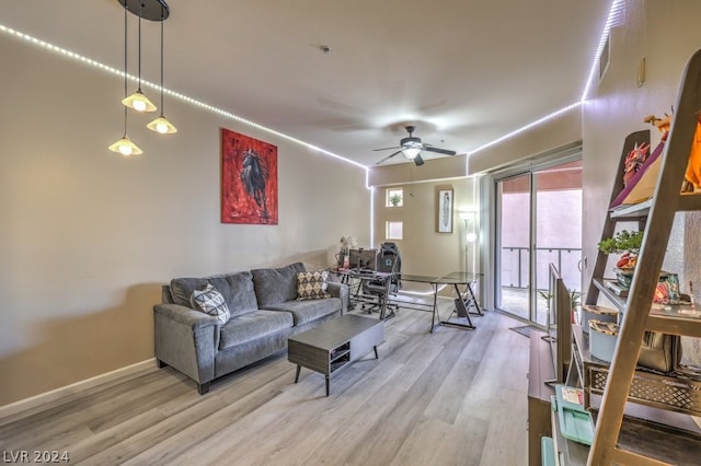 living room featuring hardwood / wood-style flooring and ceiling fan