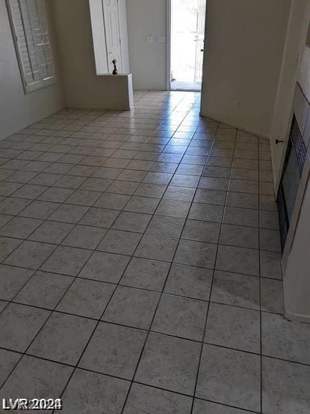 interior space featuring light tile patterned floors