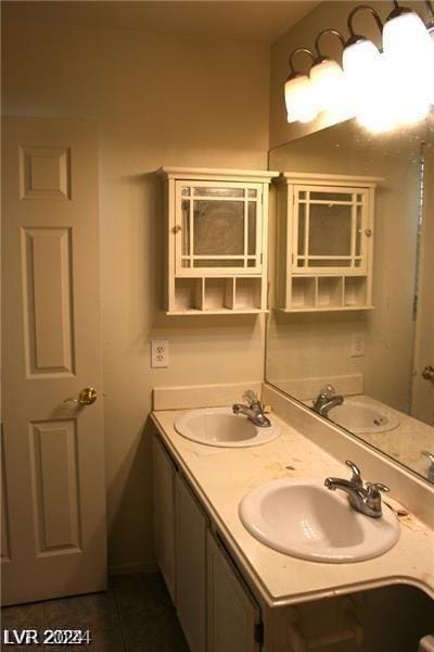 bathroom with tile patterned flooring and vanity