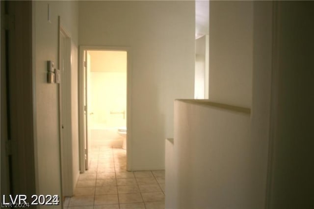 corridor with light tile patterned floors