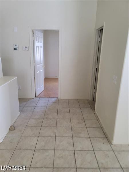 hallway with light tile patterned flooring