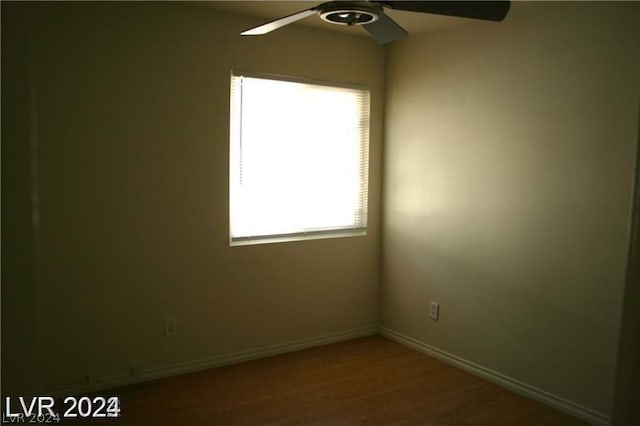 unfurnished room featuring hardwood / wood-style floors and ceiling fan