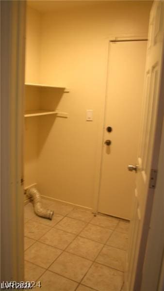 washroom with tile patterned floors