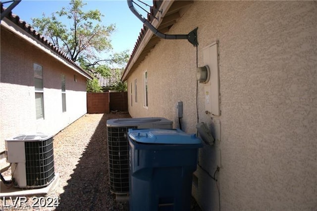 view of side of home featuring central AC