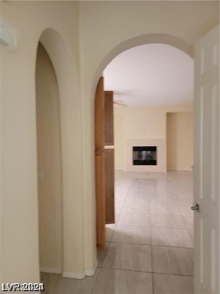 hall with light tile patterned flooring