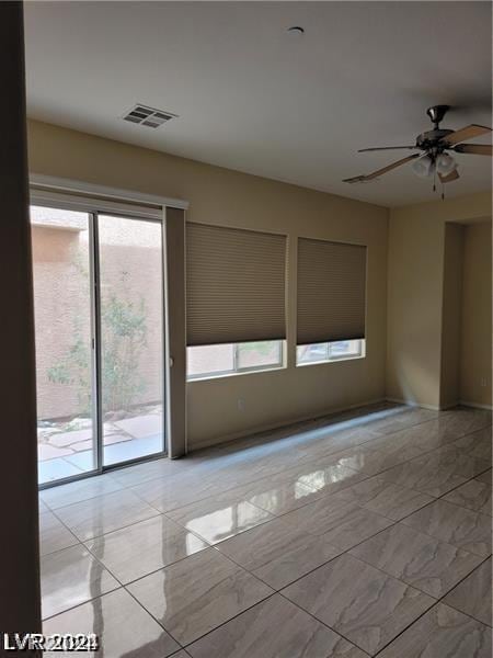 unfurnished room featuring ceiling fan