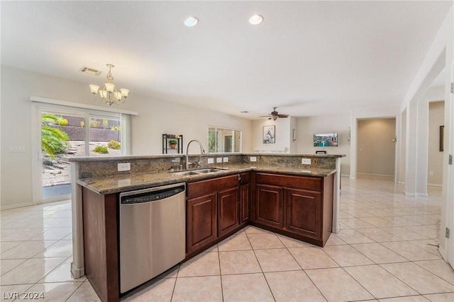 kitchen featuring light tile patterned flooring, sink, decorative light fixtures, a center island with sink, and stainless steel dishwasher