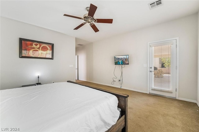 carpeted bedroom with access to outside and ceiling fan