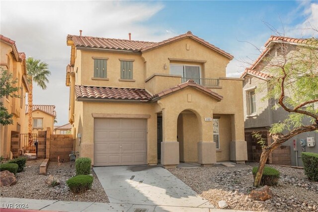 1161 Gecko Rd, Henderson, NV 89002 - mediterranean / spanish-style home with a tile roof, stucco siding, fence, a garage, and concrete driveway