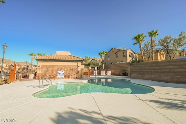 1161 Gecko Rd, Henderson, NV 89002 - community pool featuring a fenced backyard, a patio, and a residential view