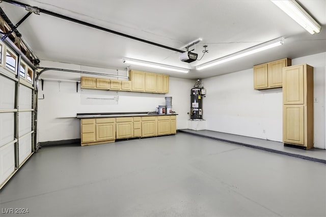 garage featuring a garage door opener and water heater