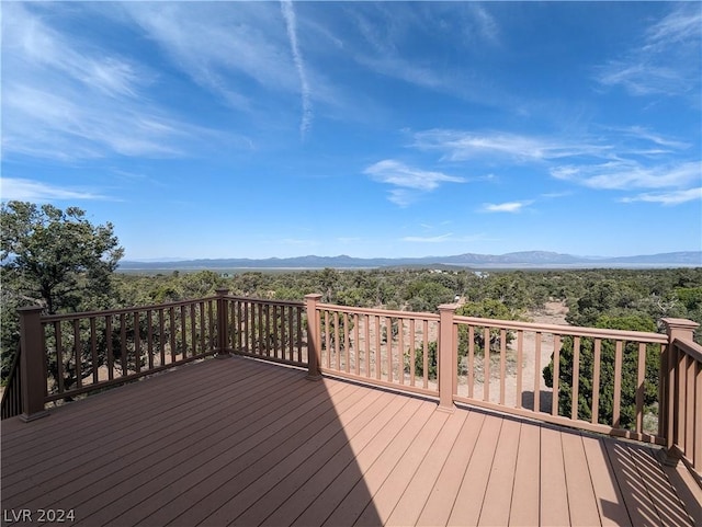 wooden deck featuring a mountain view