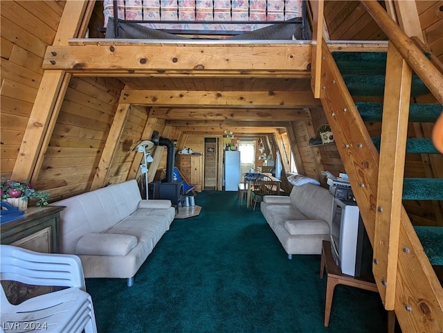 unfurnished living room featuring carpet flooring and wood walls