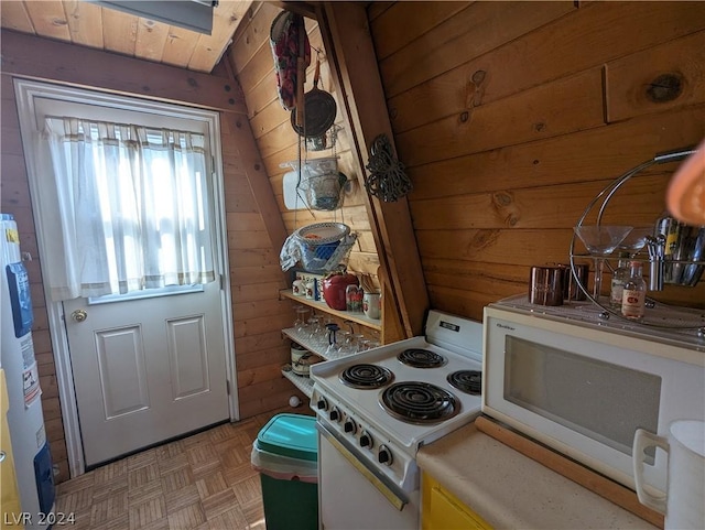 kitchen with white appliances, electric water heater, light parquet floors, wooden walls, and wooden ceiling