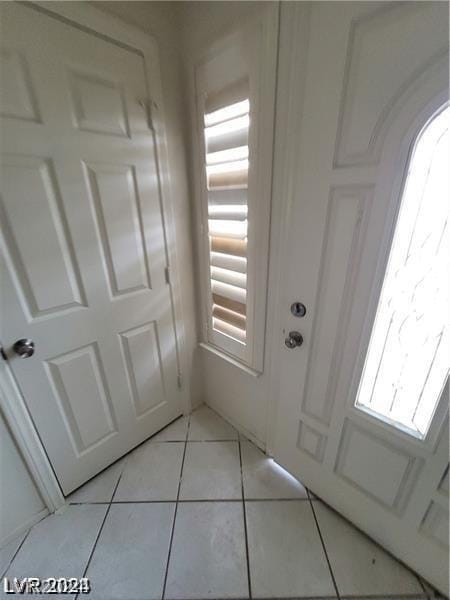 interior space with light tile patterned floors