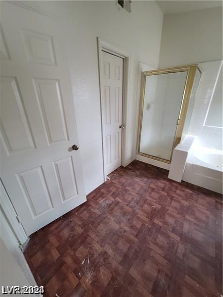 unfurnished bedroom with dark parquet floors