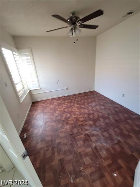 spare room with ceiling fan