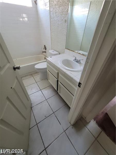 full bathroom featuring tile patterned floors, vanity, bathtub / shower combination, and toilet