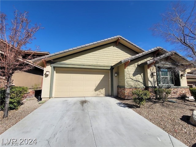 ranch-style house featuring a garage