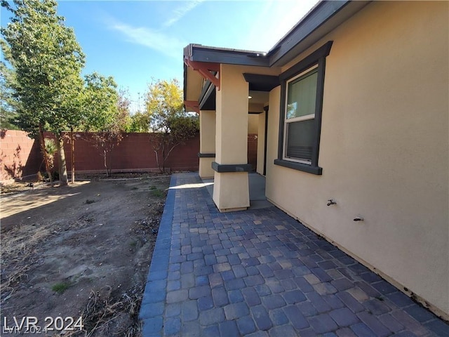 view of side of home with a patio area