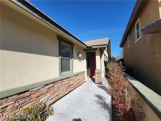 property entrance featuring a patio