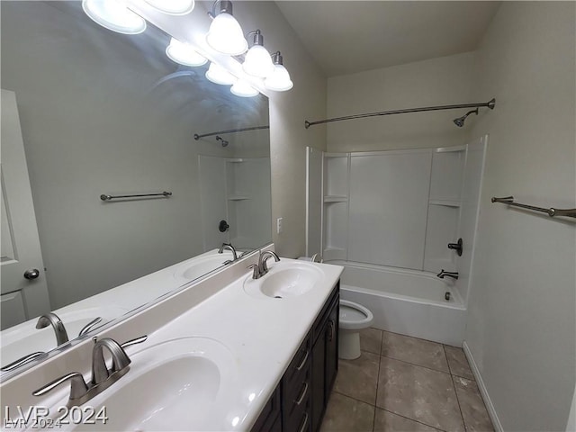 full bathroom with toilet, vanity, tile patterned floors, and shower / washtub combination