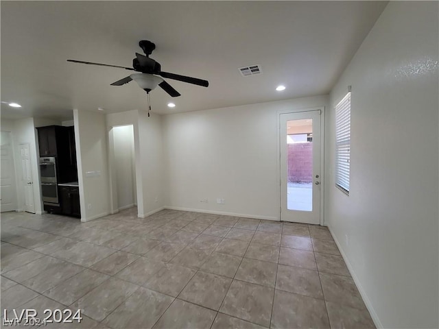 spare room with ceiling fan