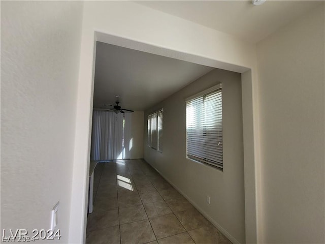 hallway with tile patterned flooring