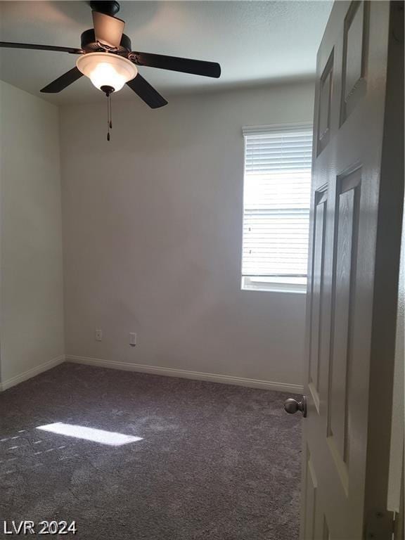 empty room featuring ceiling fan and carpet floors