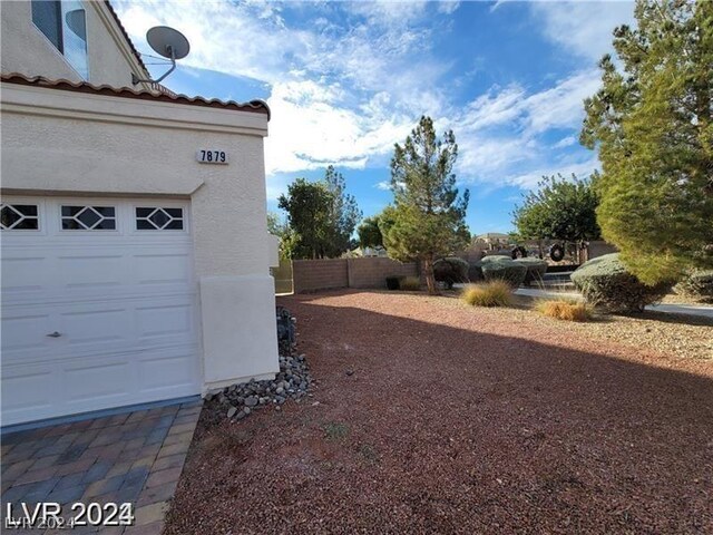 view of yard featuring a garage