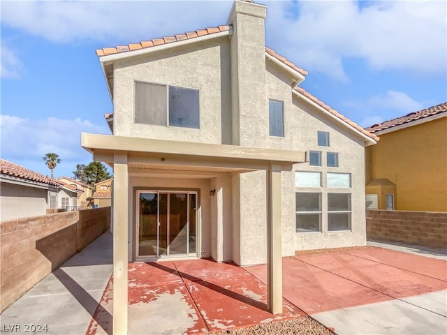 rear view of house with a patio