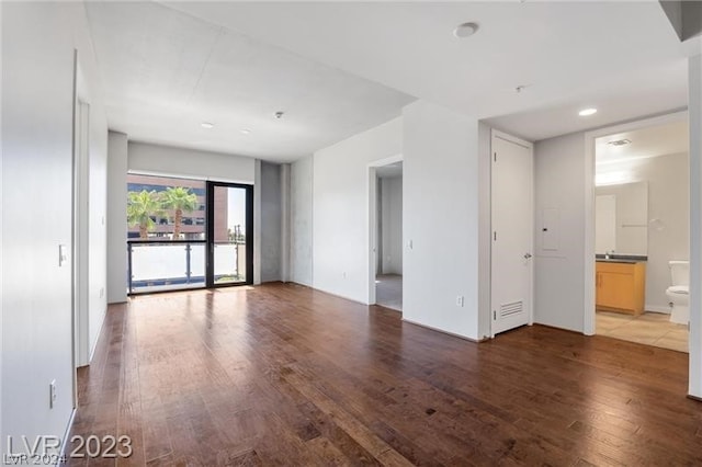 spare room with hardwood / wood-style flooring