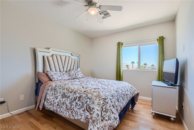 bedroom featuring ceiling fan and light hardwood / wood-style flooring