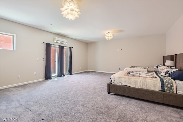 bedroom featuring carpet floors and an AC wall unit