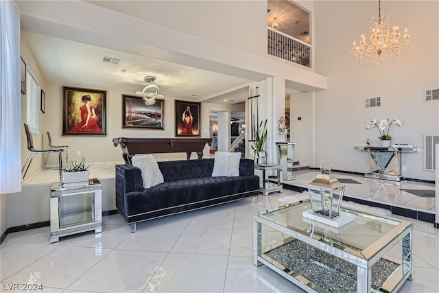 living room with billiards and a chandelier