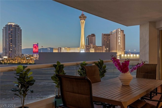 view of balcony at dusk