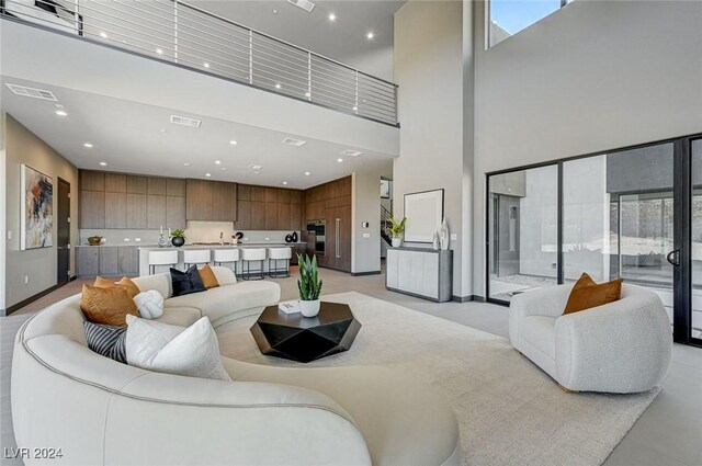 living room with a towering ceiling