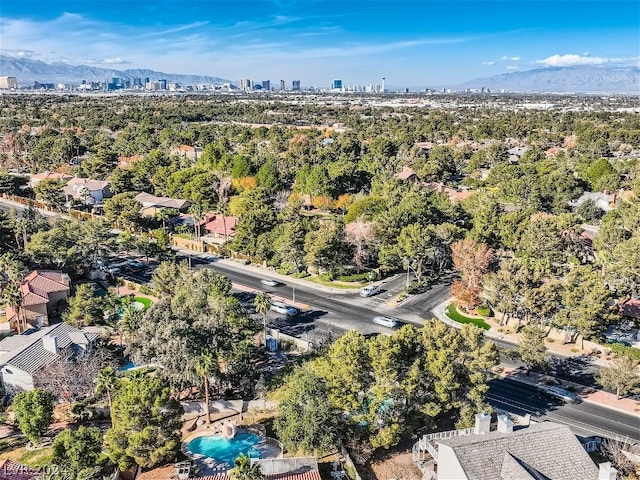 birds eye view of property with a mountain view and a city view